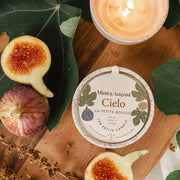 Cielo Hand Poured 3oz Natural Soy Wax Candle - these change seasonally, this fall choose from more woodsey, spicy and warming scents. Cielo, sweet notes of figs, cassis and amber. Fruity, but with some woodsiness. This is a soft scent. Hand poured candles from Mimi & August in Montreal, Quebec, a women-led, latino owned, small business. 
