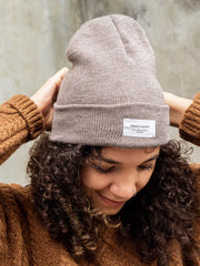Latte, knit beanie. Ethically made unisex knit beanies from Mimi & August in Montreal, Canada. These beanies or toques are now made in Montreal, Canada. This is the perfect light weight beanie for your everyday look, a classic style that really goes with anything.   Comfy & snug enough to keep your ears toasty during the colder months. 