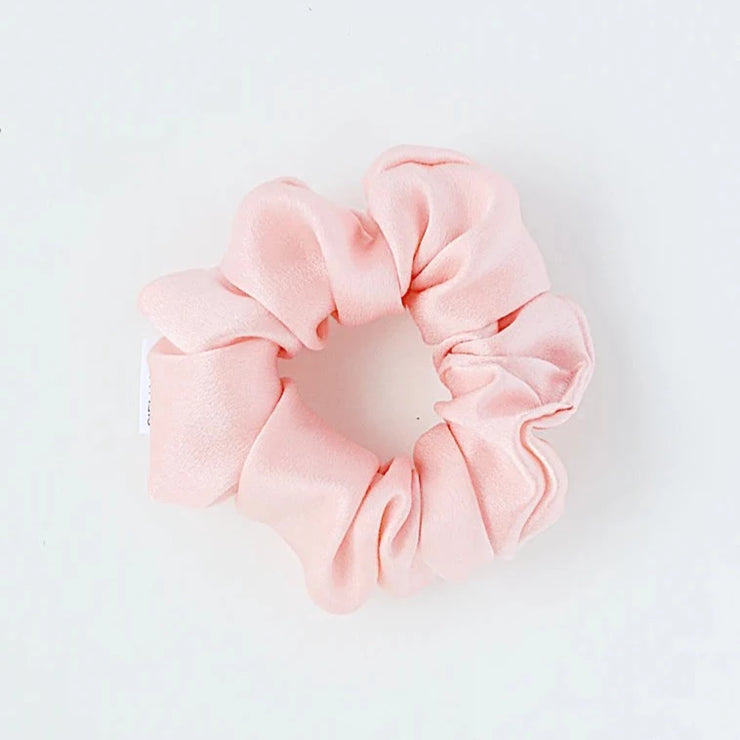Petal Pink silk hair scrunchie. Classic silk scrunchies are made of 100% silk from up-cycled Italian silk sourced from the Toronto Fashion District. Deadstock that would have otherwise ended up in the trash! Silk is very gentle on your hair! All hair scrunchies are handmade by Siena Vida, a women founded company in Toronto, Canada with a goal of transforming hair accessories to being more environmentally friendly & durable.