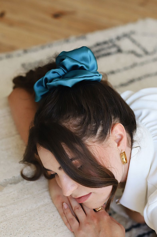Ocean Blue hair scrunchie. Classic silk scrunchies are made of 100% silk from up-cycled Italian silk sourced from the Toronto Fashion District. Deadstock that would have otherwise ended up in the trash! Silk is very gentle on your hair! All hair scrunchies are handmade by Siena Vida, a women founded company in Toronto, Canada with a goal of transforming hair accessories to being more environmentally friendly & durable.