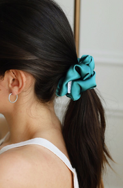 Aqua silk hair scrunchie. Classic silk scrunchies are made of 100% silk from up-cycled Italian silk sourced from the Toronto Fashion District. Deadstock that would have otherwise ended up in the trash! Silk is very gentle on your hair! All hair scrunchies are handmade by Siena Vida, a women founded company in Toronto, Canada with a goal of transforming hair accessories to being more environmentally friendly & durable.