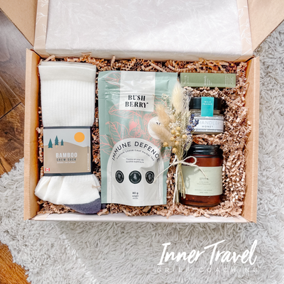 "Feel Better" Grief Gift Box. Includes locally made, Canadian products to take care & feel better. Includes immune defence tea, cozy bamboo socks, natural bath salts, raw honey and an essential oil roll-on.