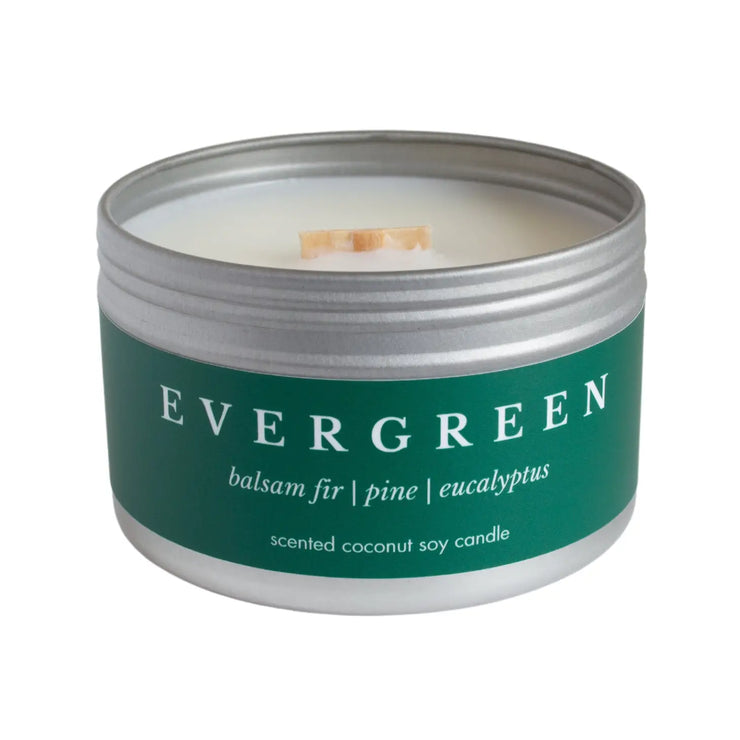 Evergreen, non-toxic coconut soy wax candle in a travel tin from Brightfield in Toronto, Ontario. Inspired by the scent of a real Christmas tree. Balsam Fir, Pine, Eucalyptus. Best selling seasonal candle for the holidays. Woman owned business.