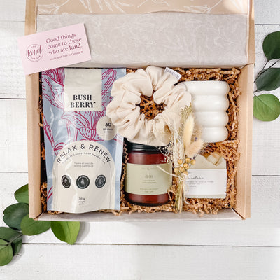Soak, a curated self care gift box. Hand crafted & naturally made products for your bath time ritual. Gift box includes; organic tea, bath salts, french soap, linen hair scrunchie, non-toxic soy wax candle.