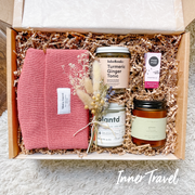 "Winter Warmth" grief gift box. Includes locally sourced, Canadian products to take care. Includes a cozy knit beanie, turmeric ginger tea, natural hand & body cream, bath salts, beeswax lip balm