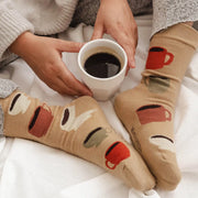 Cafecito Cotton Socks in neutral with red, green, cream coffee cups. The most comfy, cute cotton socks to sip your morning coffee in. Cafecito socks are from Mimi & August in Montreal, Quebec. Made for everyday wear and are soft to the touch.
