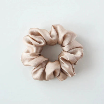 Champagne silk hair scrunchie. Classic silk scrunchies are made of 100% silk from up-cycled Italian silk sourced from the Toronto Fashion District. Deadstock that would have otherwise ended up in the trash! Silk is very gentle on your hair! All hair scrunchies are handmade by Siena Vida, a women founded company in Toronto, Canada with a goal of transforming hair accessories to being more environmentally friendly & durable.