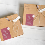 Custom gift boxes with personalized hang tags, dried flowers.