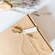 Custom gift box with personalized hang tag and dried flowers.