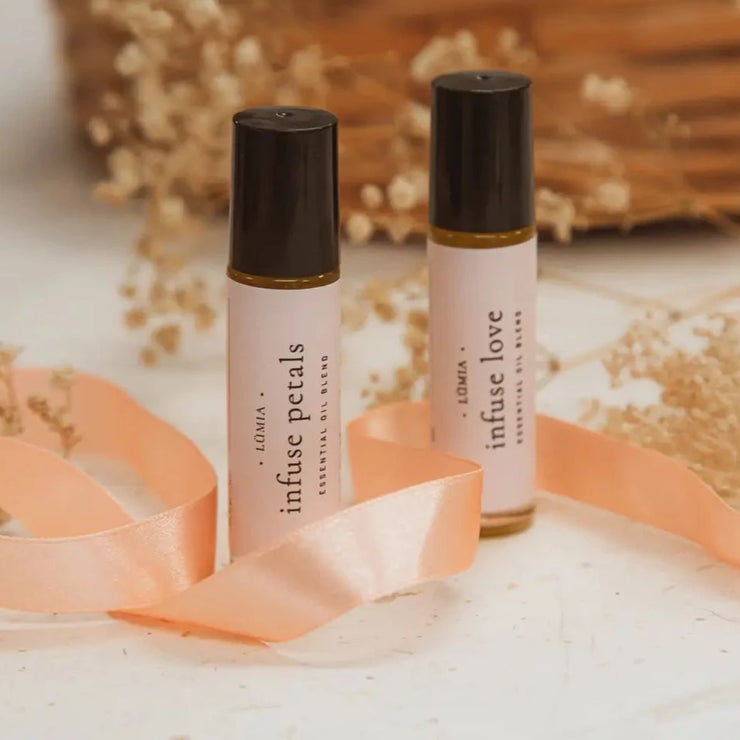 Infuse Love essential oil roll-on. Handcrafted & organic essential oil roll-on's from Lumia Botanicals on Vancouver, Island, Canada. Lumia Botanicals all natural products are crafted for intentional living and inspired by Ayurveda, the ancient healing system of India, which teaches us to live in harmony with our environment. This self-love essential oil roll-on is filled with the aromas of romantic petals & spicy seeds including Rose Geranium, Patchouli & Cardamom