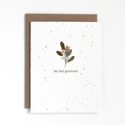 "Joy & Gratitude" holiday plantable greeting card. Our plantable greeting cards are designed and printed in Guelph, Ontario by The Good Card. Their paper is all Canadian made. Kind words that come with a little something extra - flowers!