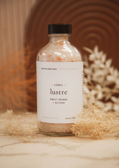 Handcrafted, natural Lustre dead sea & Himalayan bath salts from LÜMIA BOTANICALS on Vancouver, Island, Canada. Rejuvenate and soften your skin by melting into the sweet aromas of Orange & Vetiver. Dead Sea & Pink Himalayan salts help to remove impurities while sweet Orange repairs & Vetiver revitalizes.