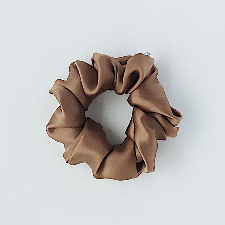 Nutmeg silk hair scrunchie. Classic silk scrunchies are made of 100% silk from up-cycled Italian silk sourced from the Toronto Fashion District. Deadstock that would have otherwise ended up in the trash! Silk is very gentle on your hair! All hair scrunchies are handmade by Siena Vida, a women founded company in Toronto, Canada with a goal of transforming hair accessories to being more environmentally friendly & durable.