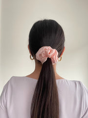 Petal Pink silk hair scrunchie in hair. Classic silk scrunchies are made of 100% silk from up-cycled Italian silk sourced from the Toronto Fashion District. Deadstock that would have otherwise ended up in the trash! Silk is very gentle on your hair! All hair scrunchies are handmade by Siena Vida, a women founded company in Toronto, Canada with a goal of transforming hair accessories to being more environmentally friendly & durable.