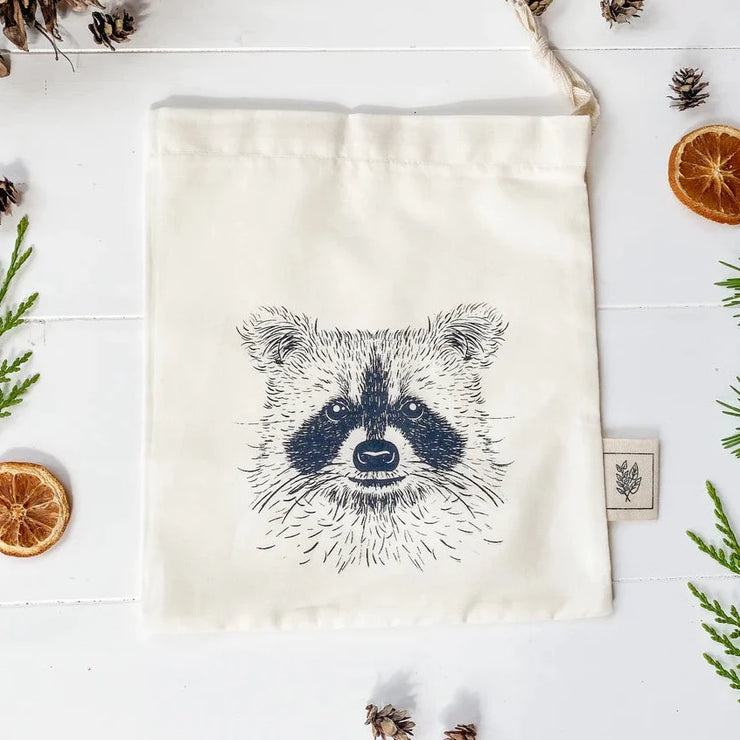 This little reusable Raccoon bag was made for our Toronto masked bandit lovers!   Handmade organic cotton reusable drawstring/ gift bag from Your Green Kitchen in Nakusp, British Columbia. Use for gift wrapping as a reusable option or for everyday use such as for produce, bread, snacks.  Your Green Kitchen is a woman founded & owned business that creates beautiful eco-friendly and toxin-free products for your home.  Made with 100% GOTS organic unbleached cotton, super absorbent and washes like a dream.