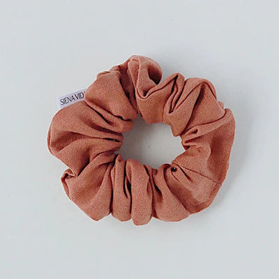 Tuscany linen hair scrunchie. Classic linen hair scrunchies are handmade by Siena Vida, a women founded company in Ontario, Canada with a goal of transforming hair accessories to being more environmentally friendly & durable.  Vanessa the founder, sources sustainable fabric for her hair scrunchies from local, women led businesses that produce high quality, long lasting material.