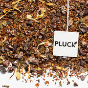 After Dinner Mint  rooibos, caffeine-free tea from Pluck Tea in Toronto. This smooth chocolate peppermint rooibos tea is lovingly blended with freshly roasted cacao nibs and shells from Chocosol - a direct trade bean – to – bar chocolate maker located in Toronto. Soothing, decadent, and caffeine – free.