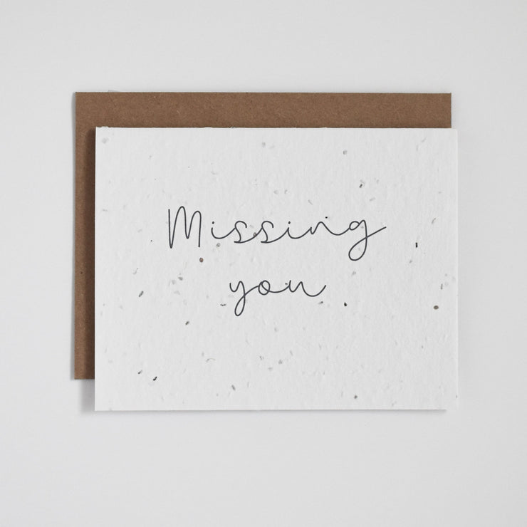 "Missing You". Our plantable greeting cards are designed and printed in Guelph, Ontario by The Good Card. Their paper is all Canadian made. Kind words that come with a little something extra - flowers!  Plantable seed paper cards are made from bio-degradable, post-consumer waste meaning no new trees are harmed. Each card is full of a blend of 6 different wildflower seeds, that are all tested for purity, non-GMO, and non-invasive. All cards are printed with non-toxic ink