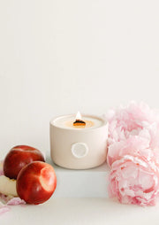 The Magic Hour coconut & soy wax candle. Hand poured in Toronto by Pinky Swear & Co. Pink Peony & Nectarine. The Magic Hour pays tribute to that perfect evening glow where the world is transformed into momentary paradise. With irresistible blooming pink peony and juicy nectarine subtly blended with delicious vanilla bean, this fragrance is the true essence of summertime bliss. Bask in the glow of nature's most alluring seasonal fragrances for a magical hour, or two or three… 